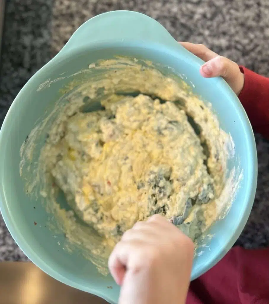 A mixing bowl with the cheese mixture forr the lasagna.