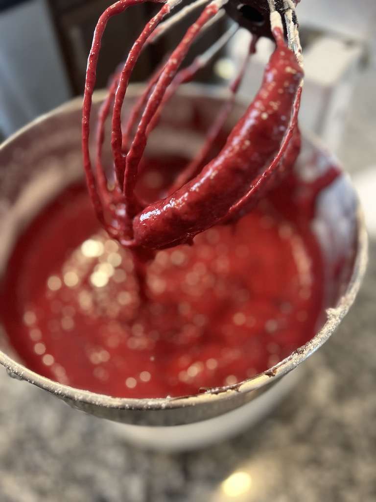 Chocolate beet muffin batter on a standing mixer blade.