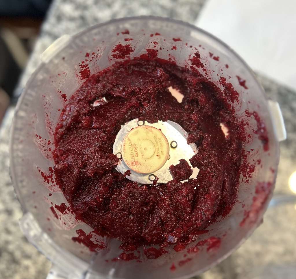 Freshly steamed beet roots peeled and pureed in a food processor.