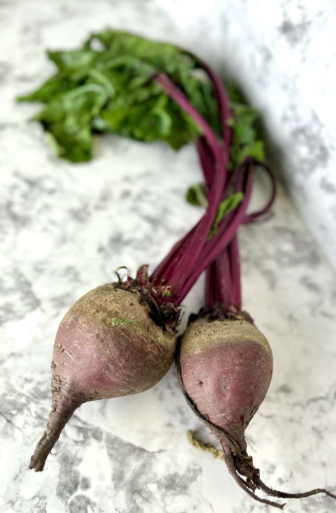 Beet roots on a counter top.