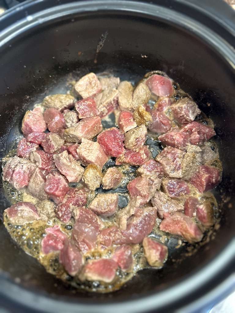 Browning the meat for chimichangas in a dutch oven in a bit of olive oil.