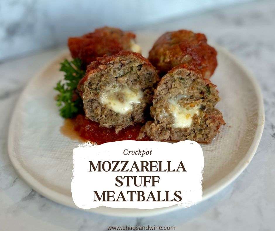 mozzarella stuffed meatballs on a plate.