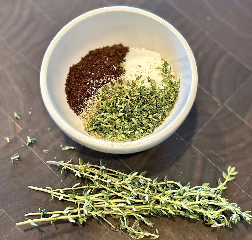 Coffee-Rubbed Tri-Tip with Bourbon Mushroom Cream Sauce Coffee Rub for the tri tip steak including salt, fresh chopped thyme, and coffee.