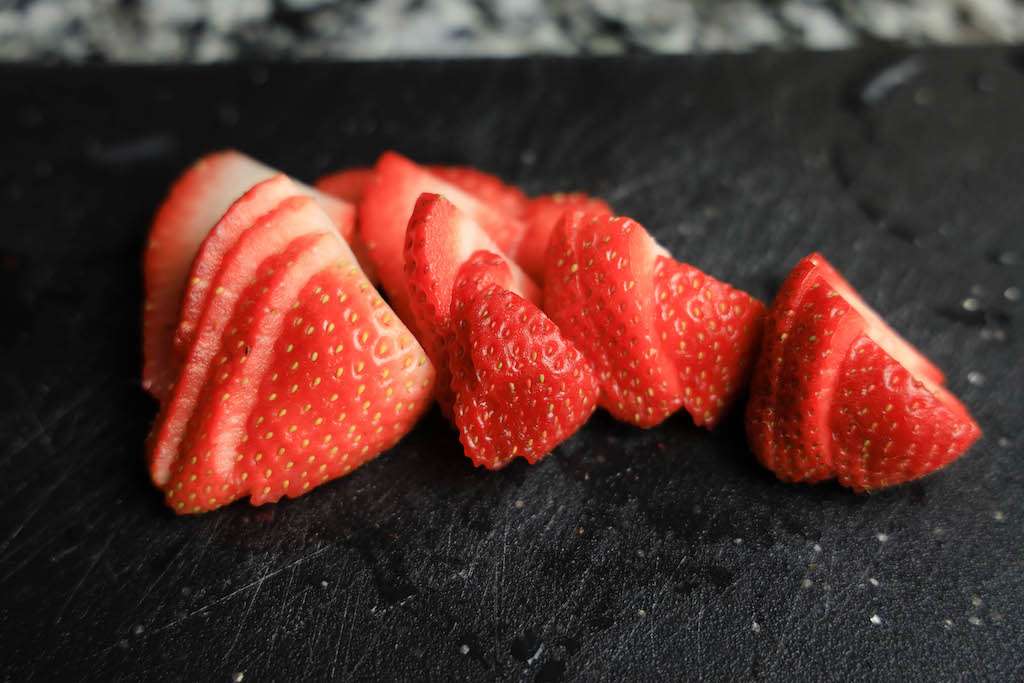 Fresh sliced strawberries for strawberry lemonade.