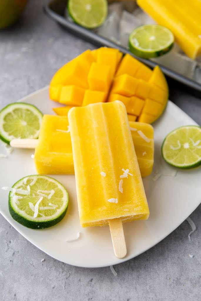14 Sugar Free Popsicle Recipes Mango Lime Popsicles on a plate 2