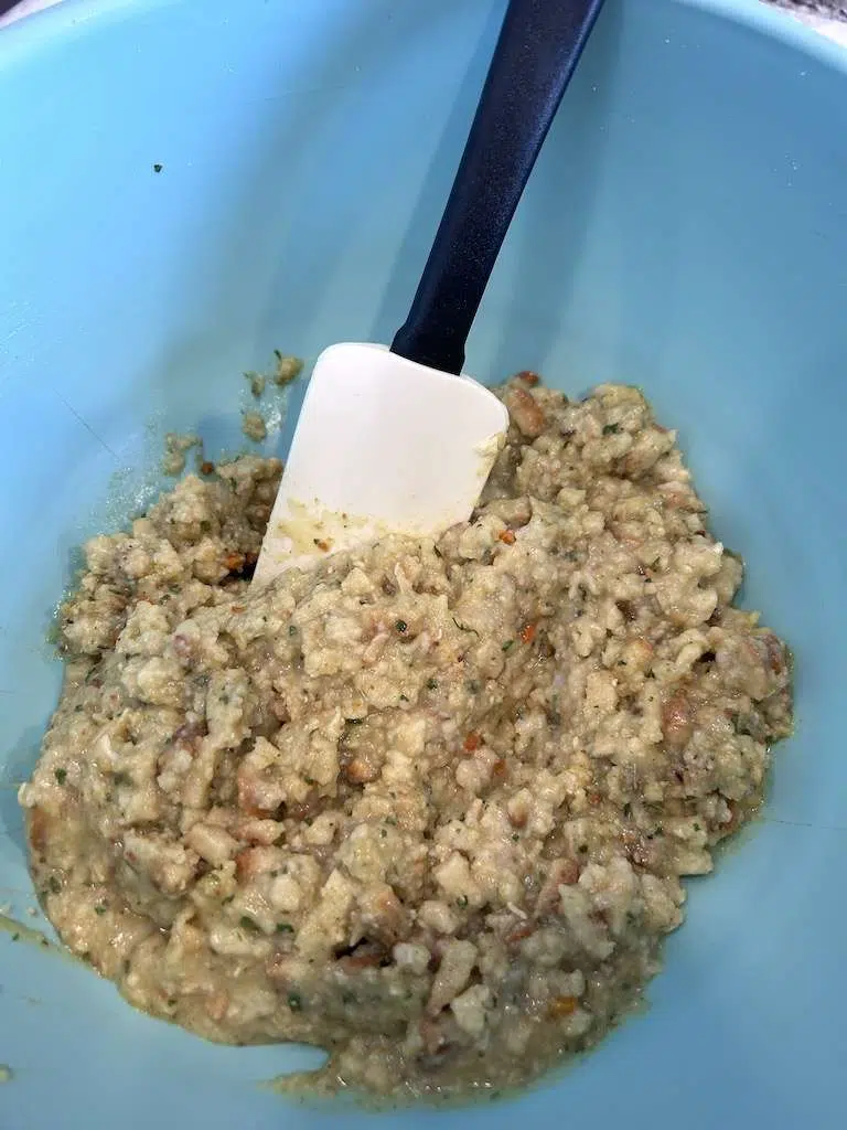 The box of stuffing and cream of chicken soup in a blue mixing bowl.