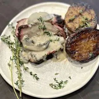 Coffee-Rubbed Tri-Tip with Bourbon Mushroom Cream Sauce Plated Coffee Rubbed Tri-Tip with Grilled Potatoes