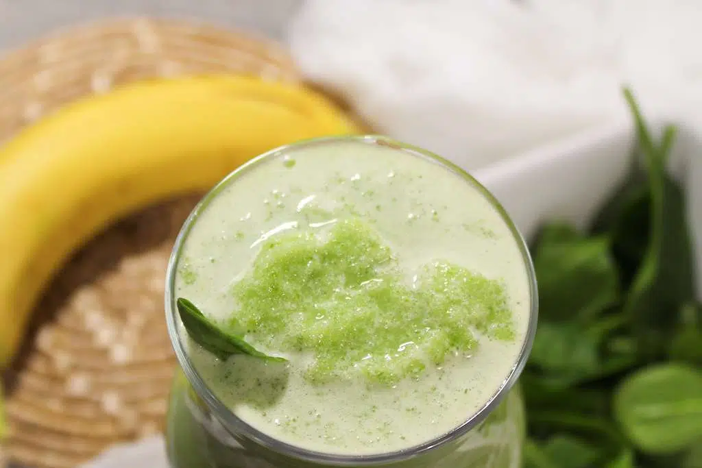 Refreshing Spinach Banana Smoothie Spinach Banana Smoothie looking into the cup.