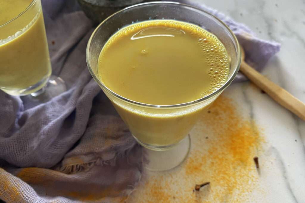 Golden milk in a glass.