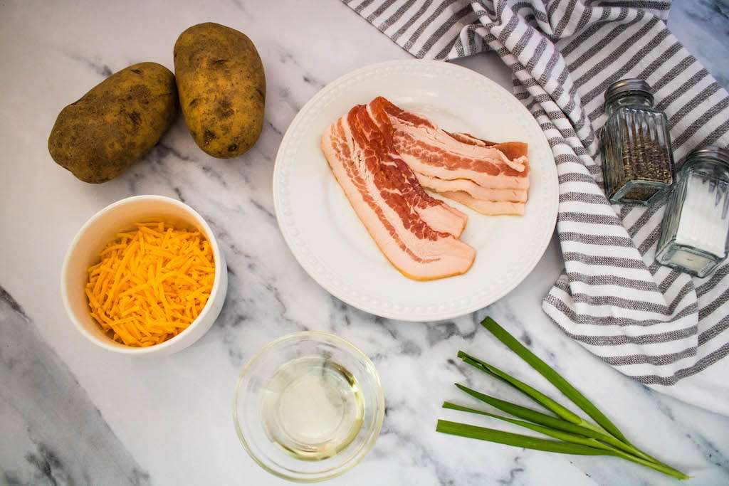 The ingredients for bacon and cheddar air fryer potato slices.