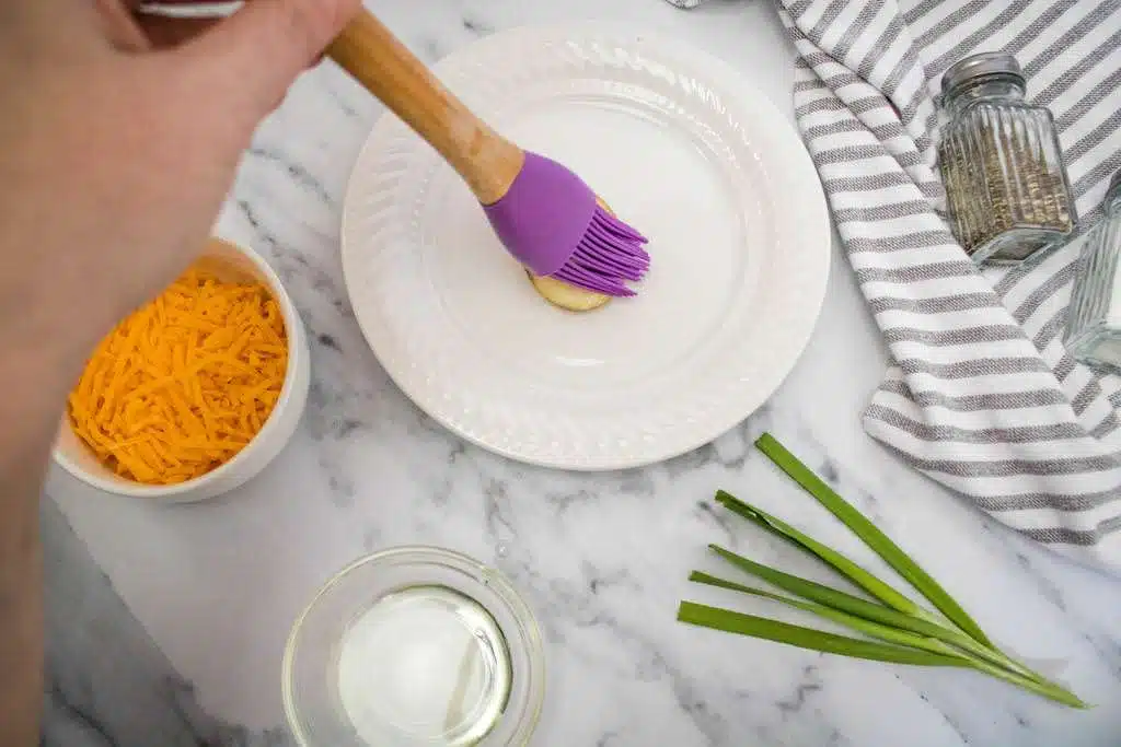 Brush the potato slices with olive oil.