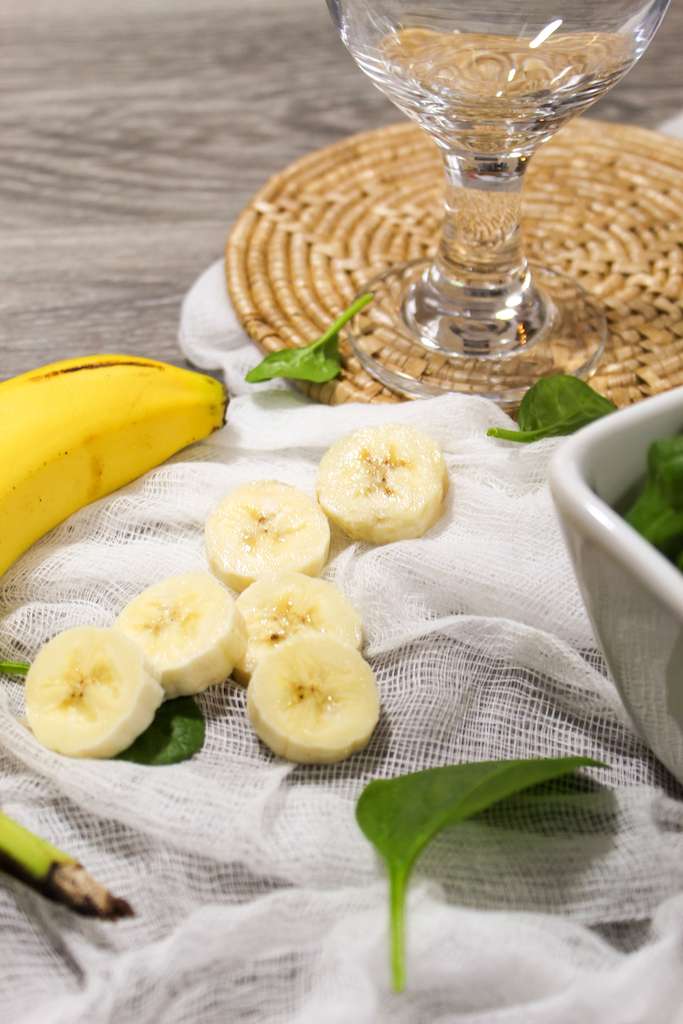 Spinach Banana Smoothie ingredients including sliced bananas and fresh spinach.