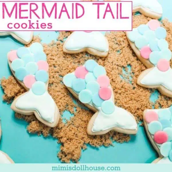 Mermaid tail sugar cookies with blue and pink scales on brown sugar sand