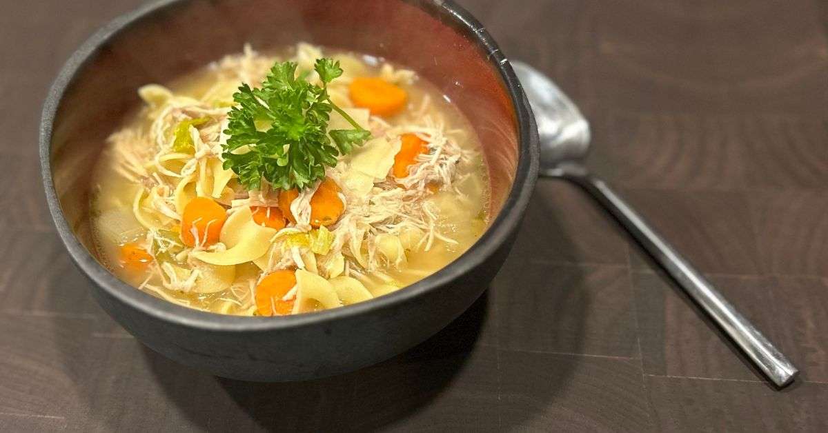 Chicken Noodle Soup in a bowl garnished with parsley