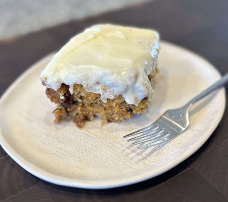 Cake cake piece on a white plate with a fork