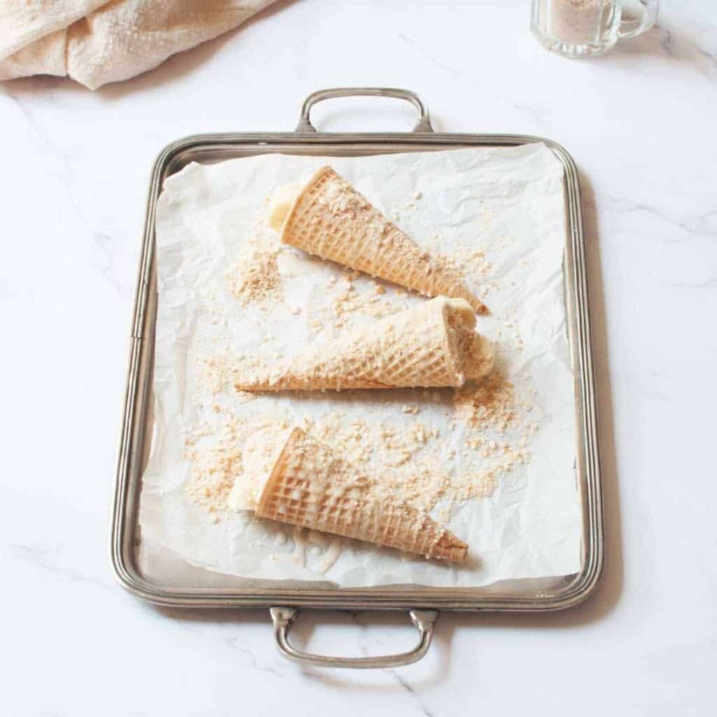 23 Fun Facts About Bananas Three waffle ice cream cones with crumbs on a parchment-lined baking sheet
