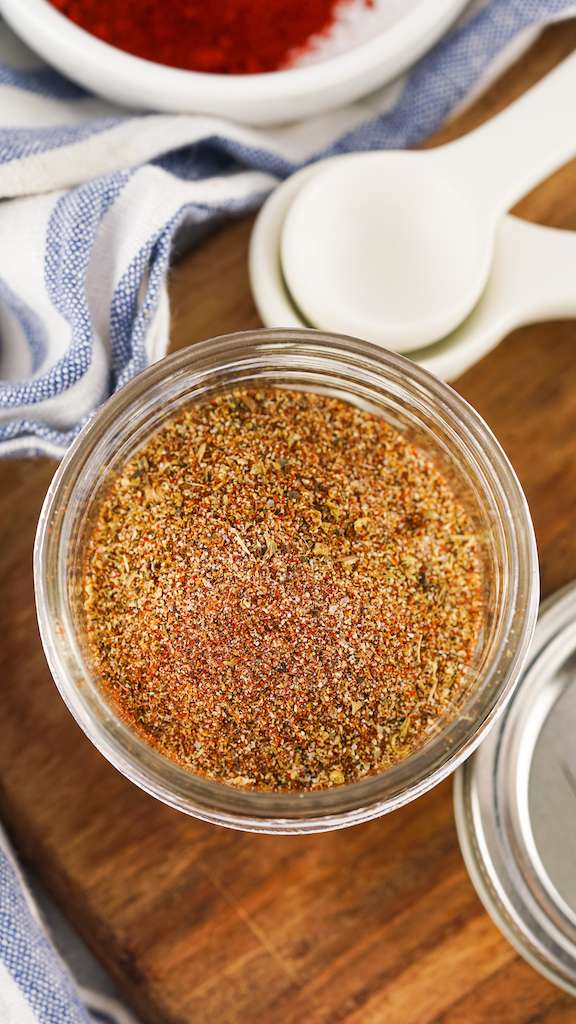 Looking down into a jar of homemade taco seasoning in a mason jar.