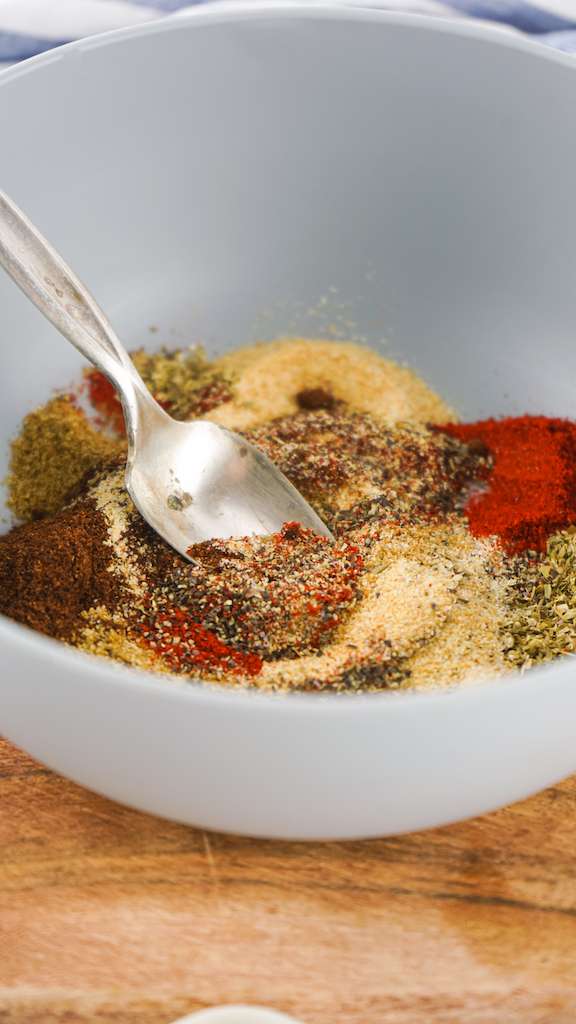 Stirring all of the spices for homemade taco seasoning in a small mixing bowl.