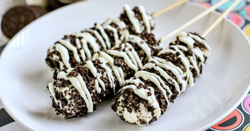Oreo Marshmallow pops on a white plate