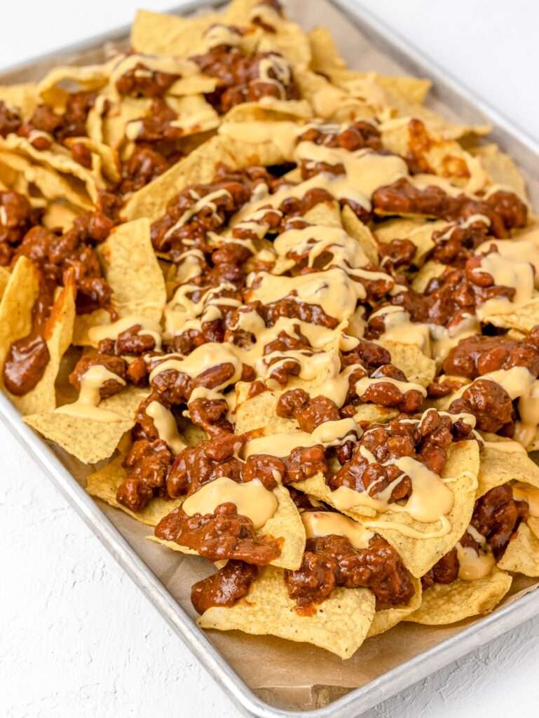12 Creative Leftover Chili Recipes Sheet pan nachos topped with beef chili and melted cheese
