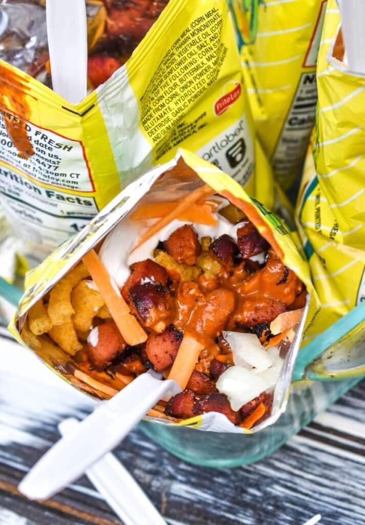 14 Walking Recipes Perfect for Camping Walking taco Frito pie with chili, cheese, onions, and hot dog