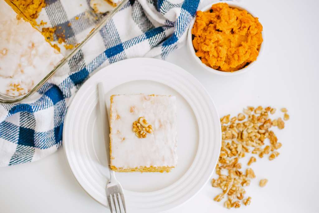 Pumpkin Honey Bun Cake slice on a white plate.