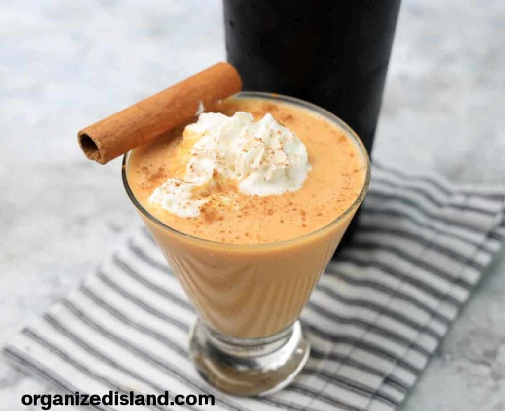 11 Delicious Pumpkin Cocktails to Try This Fall Pumpkin spice latte in glass with whipped cream and cinnamon stick