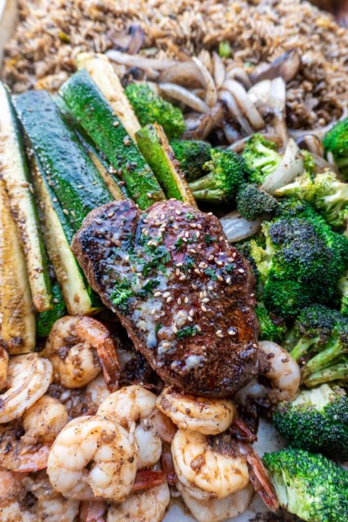 15 Best Blackstone Recipes Hibachi steak and shrimp with zucchini, broccoli, onions, and fried rice