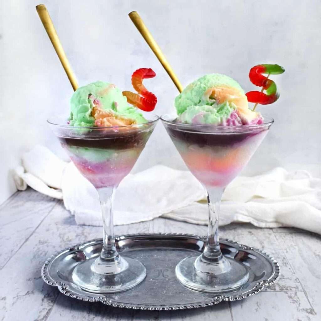 16 Easy & Spooky No Bake Halloween Treats Rainbow sherbet ice cream floats in martini glasses with gummy worms