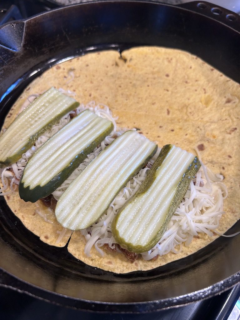 The Cuban sandwich quesadilla with the garlic aioli, shredded pork, Swiss cheese and Dill pickle slices.
