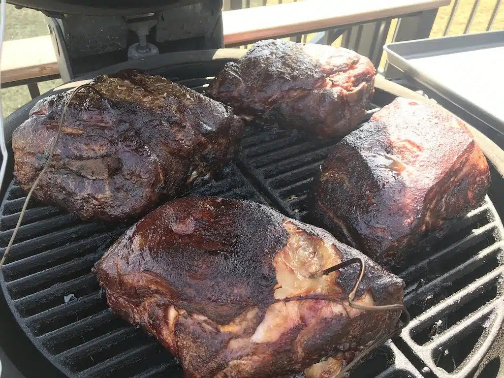 Flame Boss 500 Review: Is It Worth the Investment? 4 pork butts on the Kamado Joe grill with Flame Boss 500 multiple meat probes.