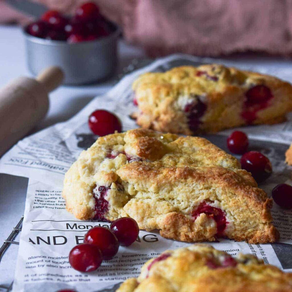 8 Traditional Christmas Flavors Buttery homemade cranberry scones with fresh cranberries