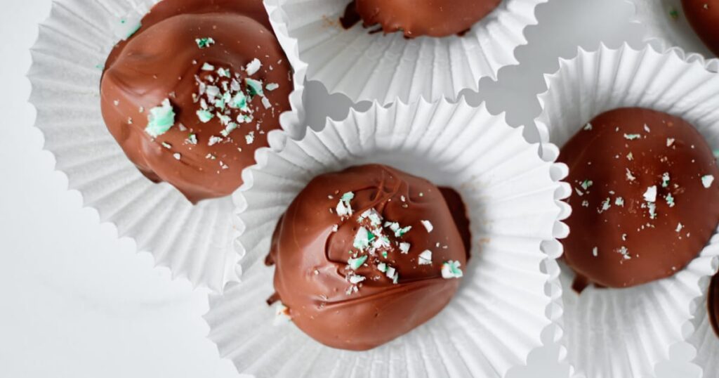 8 Traditional Christmas Flavors Chocolate mint truffles with crushed peppermint in white paper cups
