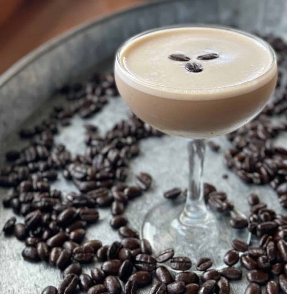 11 Christmas Cocktails with Baileys Espresso martini cocktail in a coupe, garnished with coffee beans