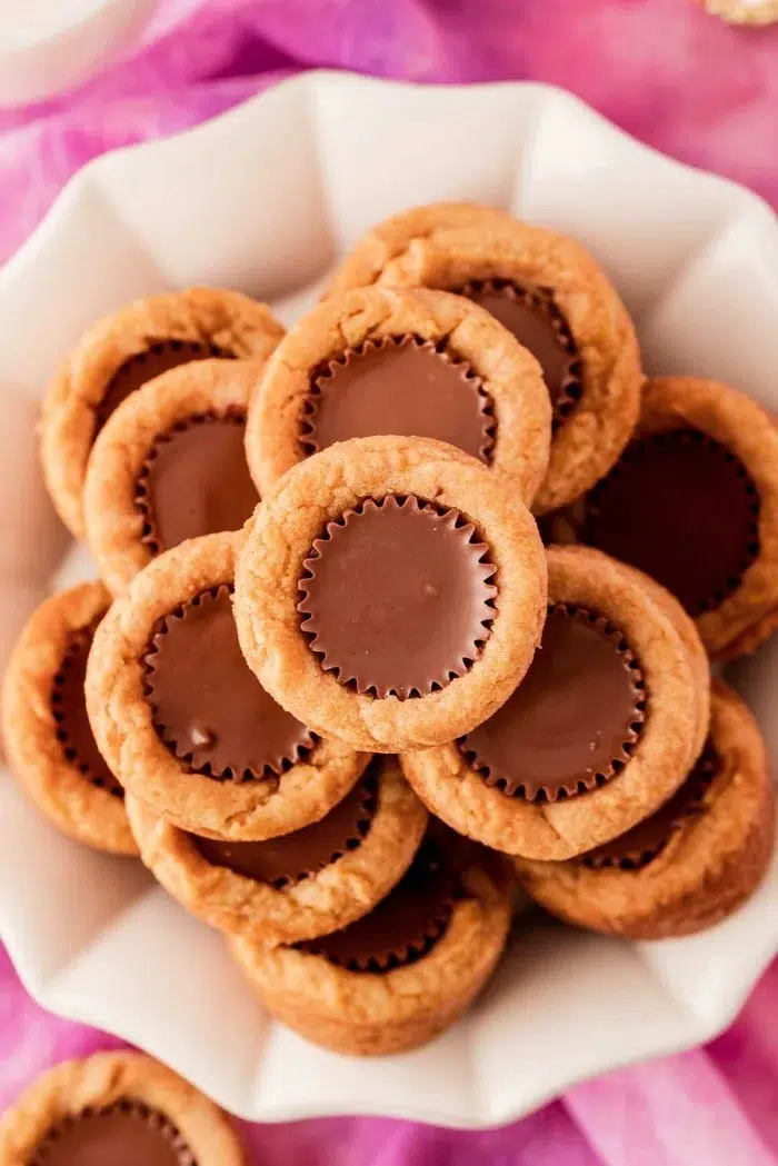Peanut Butter cookie cups on a white dish.