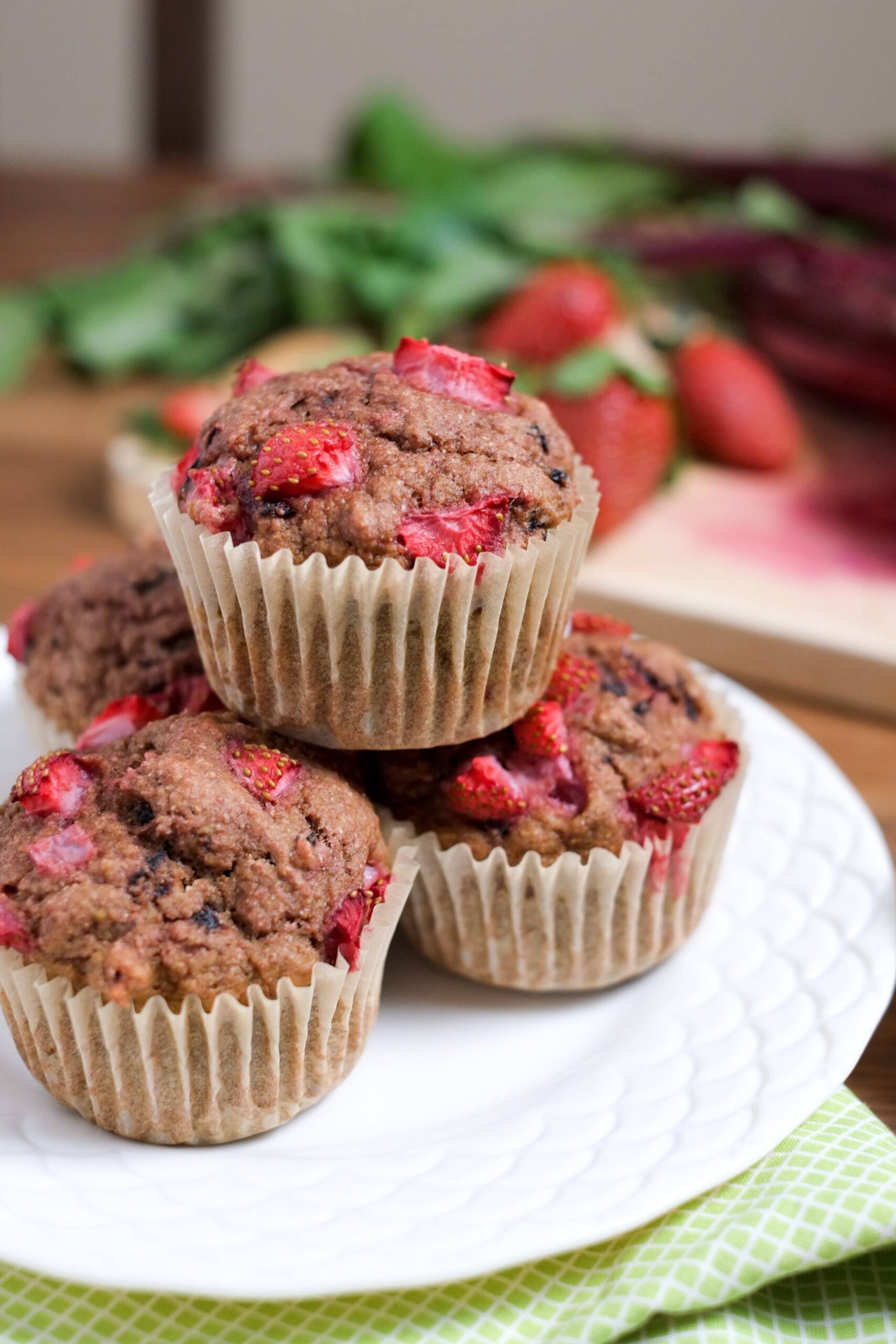 Strawberry beet muffins on a white plate.