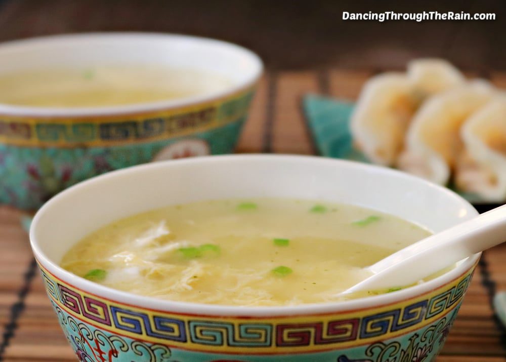 An Asian bowl filled with egg drop soup.
