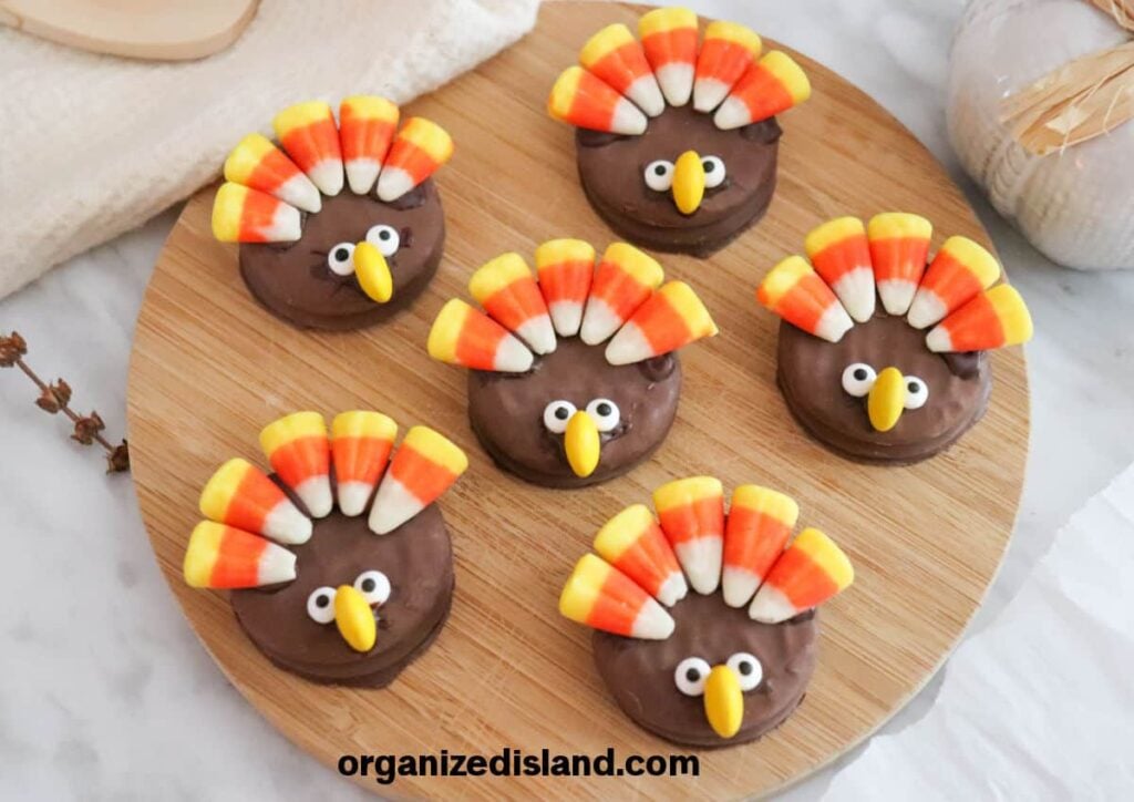 8 Delectable Turkey Desserts for Thanksgiving Thanksgiving turkey Oreo cookies with candy corn feathers on board