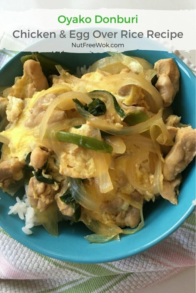 Oyako donburi chicken and egg rice bowl with onions and scallions