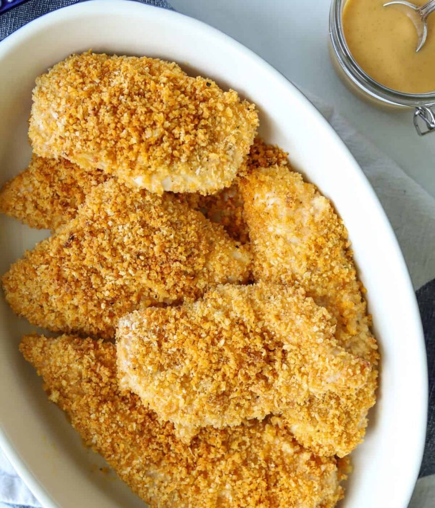 13 Recipes for Thinly Sliced Chicken Breasts A Corning Wear dish full of baked panko crusted thinly sliced chicken breasts.