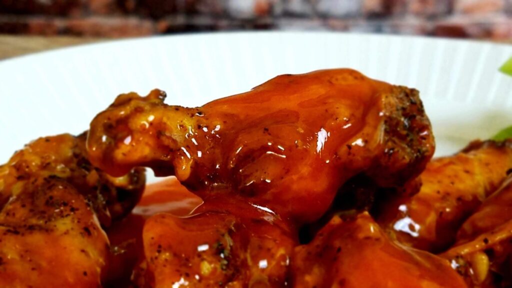 8 Irresistible Buffalo Wild Wings Copycat Recipes Close-up of spicy buffalo chicken wings coated in hot sauce