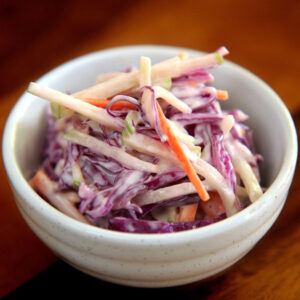 Spicy Cowboy candy coleslaw in a white bowl.