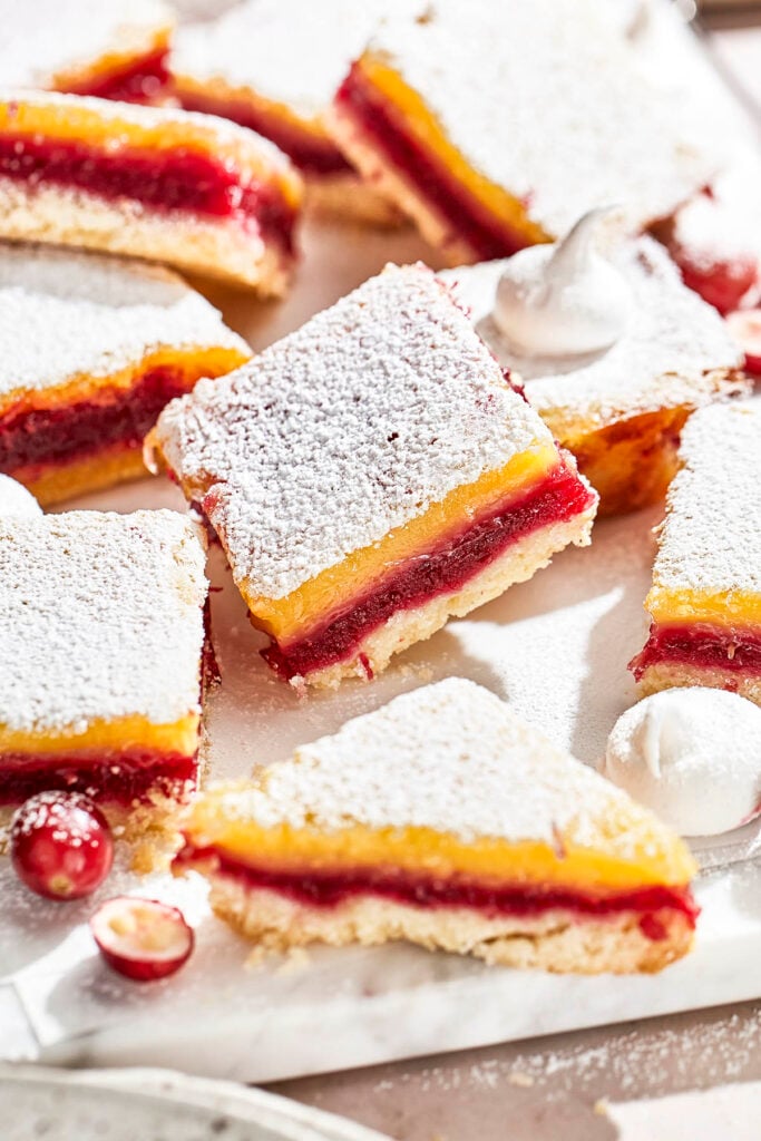 Cranberry lemon bars with shortbread crust, dusted with powdered sugar