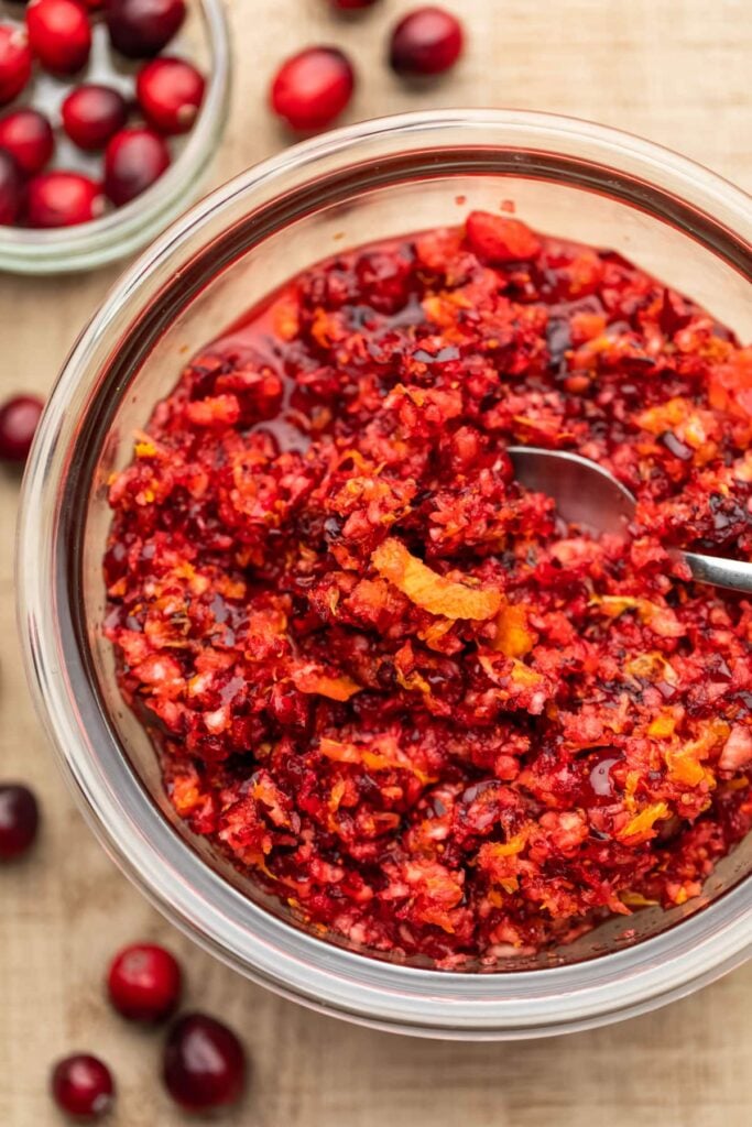 Cranberry orange relish with zest in a glass bowl, holiday side dish