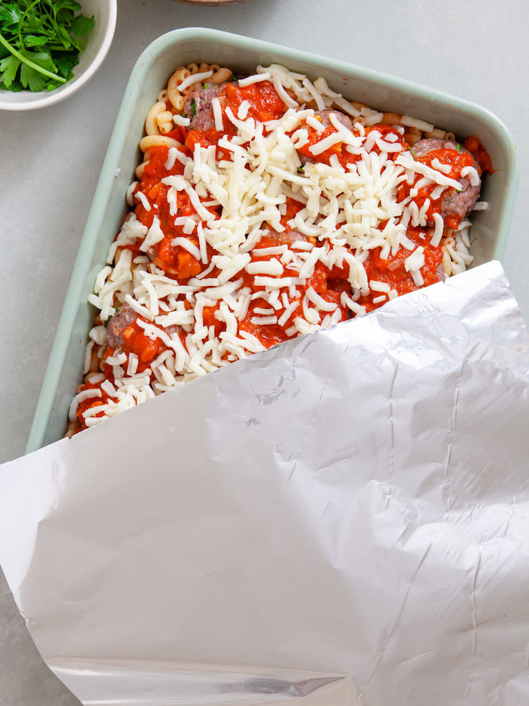 Cover the meatball casserole with aluminum foil.