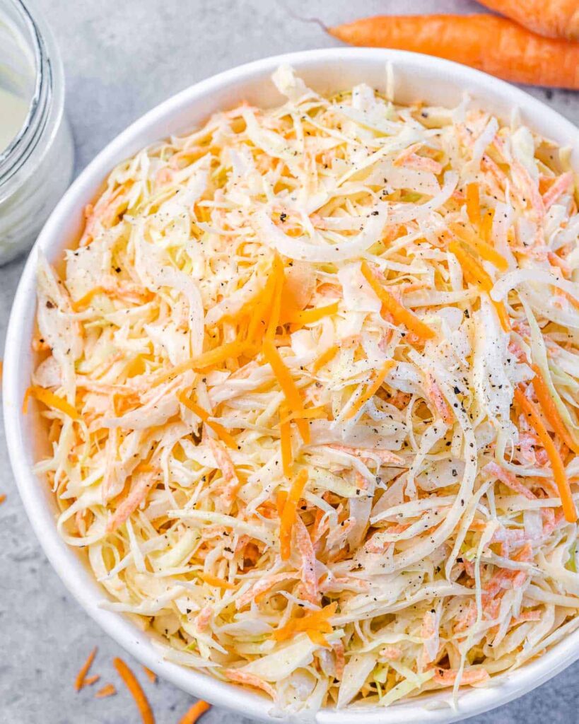 Homemade creamy coleslaw with shredded cabbage and carrots