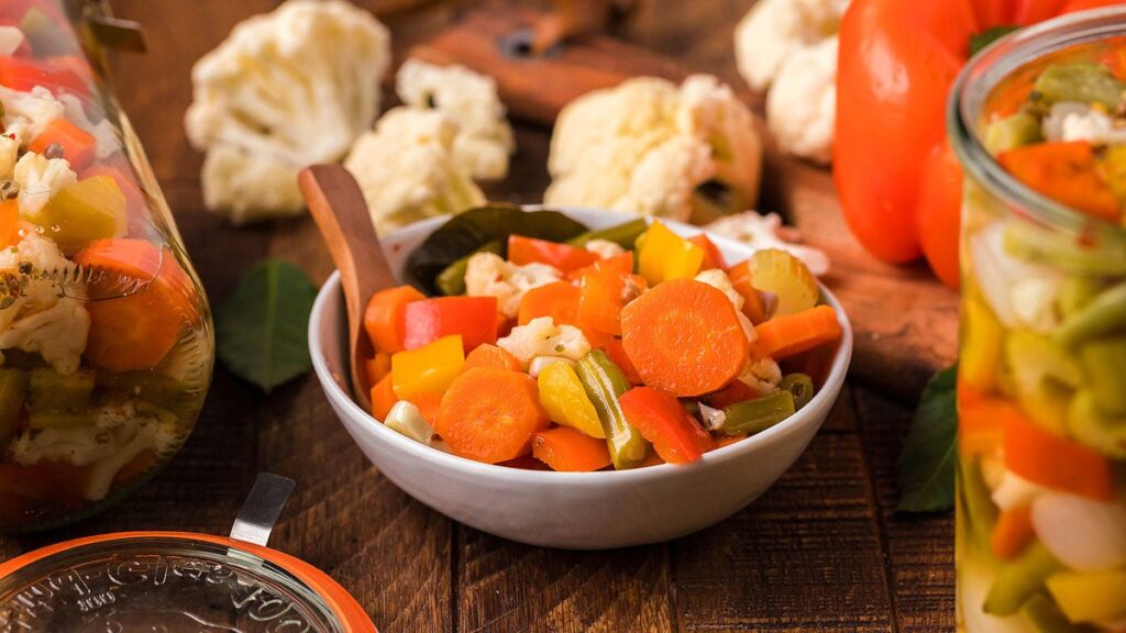 Bowl of giardiniera pickled vegetables with carrots and cauliflower
