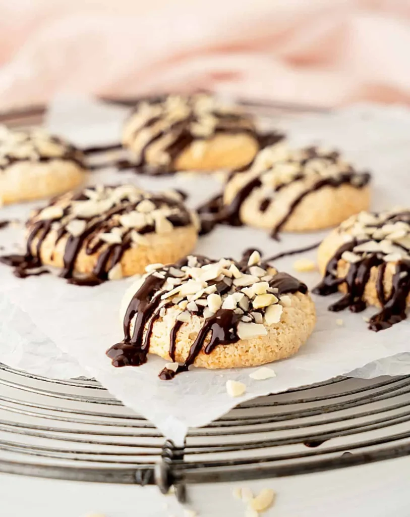 Delicate Italian almond macaroons drizzled with rich chocolate, a gluten-free and healthy dessert option for special occasions.