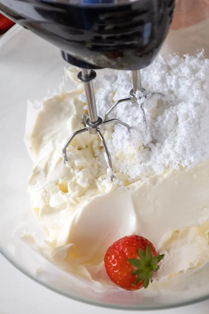 making a cream for strawberry cheesecake