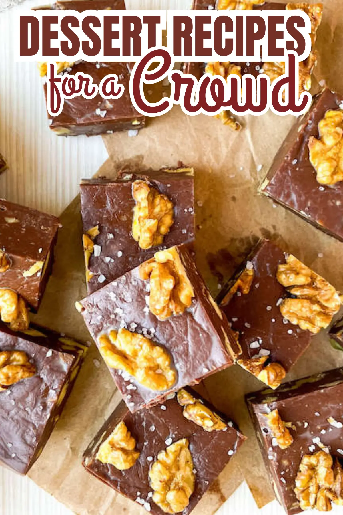 Overhead view of chocolate walnut fudge squares sprinkled with sea salt, perfect party dessert for a crowd
